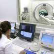 medical technician doing ct scan in hospital